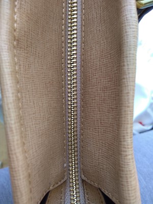 Lot 77 - A Coach tan leather tote bag