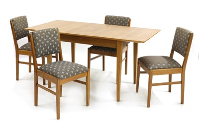 Lot 403 - A Gordon Russell walnut dining table