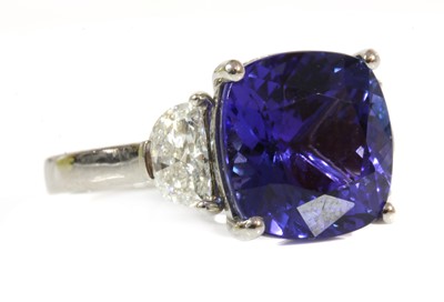 Lot 354 - A platinum three stone tanzanite and diamond ring