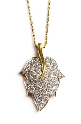 Lot 302 - An 18ct yellow and white gold diamond set leaf pendant