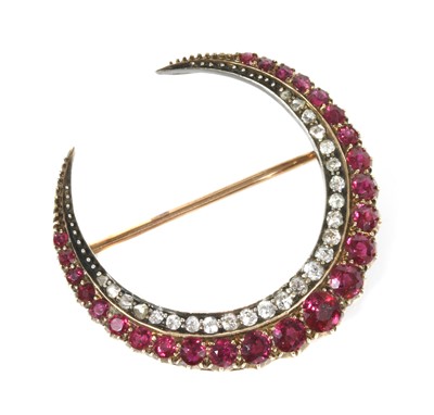 Lot 43 - A late Victorian ruby and diamond closed crescent brooch