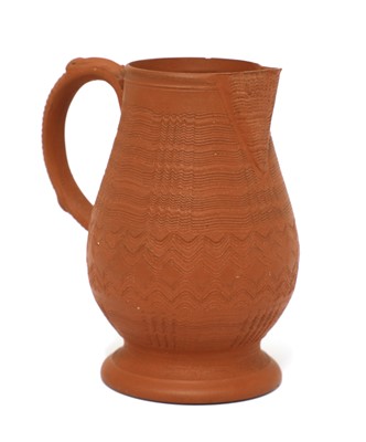 Lot 167 - A Staffordshire redware baluster-shaped milk jug