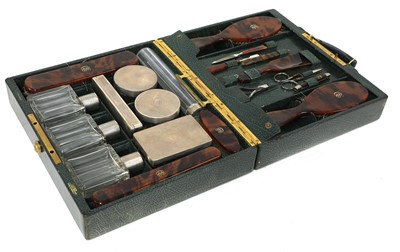Lot 55 - A green leather vanity case by Cartier