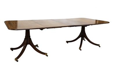 Lot 932 - A George III-style mahogany twin pedestal dining table