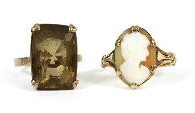 Lot 332 - A gold single stone smoky quartz ring