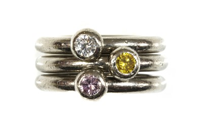 Lot 452 - A set of three 18ct white gold diamond set stacker rings