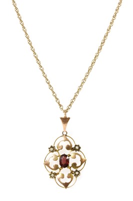 Lot 33 - An Edwardian gold garnet and split pearl pendant