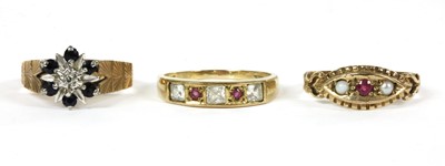Lot 337 - A 9ct gold diamond and sapphire cluster ring