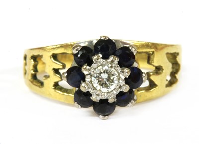 Lot 195 - A gold diamond and sapphire cluster ring