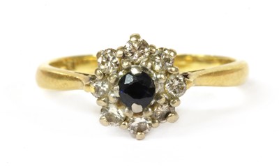 Lot 194 - A gold sapphire and diamond cluster ring