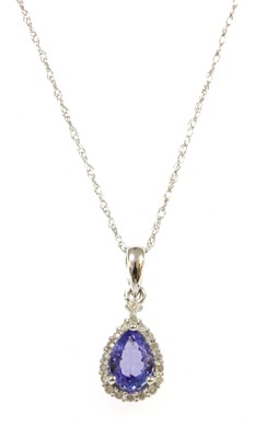 Lot 293 - A white gold tanzanite and diamond pendant