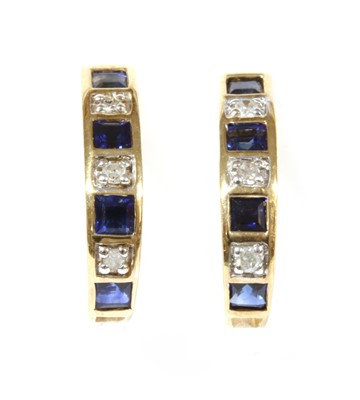 Lot 202 - A pair of gold sapphire and diamond 'J' hoop earrings