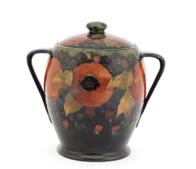 Lot 64 - A William Moorcroft 'Pomegranate' biscuit barrel and cover