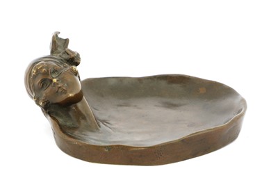 Lot 223 - A bronze pin dish