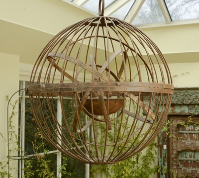 Lot 7 - A large wrought iron gimballed light fitting