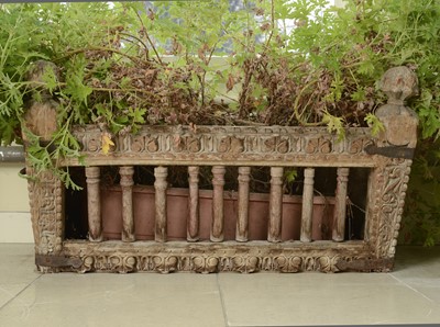 Lot 9 - A carved hardwood manger/plant stand