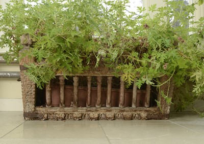 Lot 9 - A carved hardwood manger/plant stand