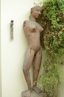 Lot 16 - A near pair of life-sized carved wooden standing female figures