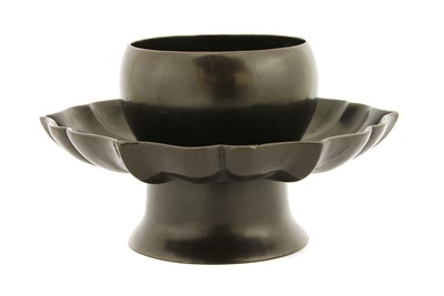 Lot 252 - A Chinese brown-lacquered cup stand