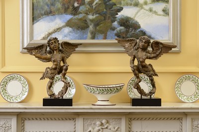 Lot 117 - A pair of carved, polychrome painted and gilt angel figures