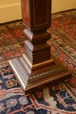 Lot 101 - A pair of mahogany torchères in the manner of George Bullock