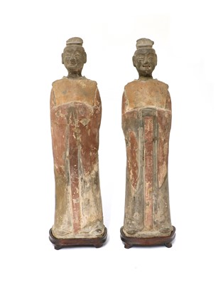 Lot 15 - A pair of Chinese pottery figures
