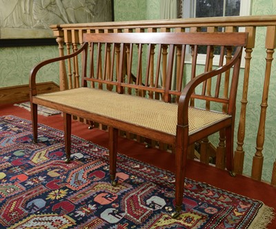 Lot 52 - A Regency-style satinwood settee