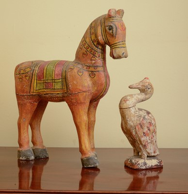 Lot 284 - A carved and painted wooden horse