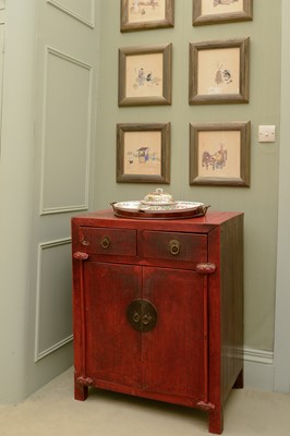 Lot 351 - A Chinese red-lacquered low cupboard