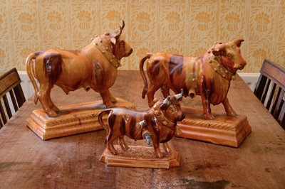 Lot 255 - A large Portuguese treacle-glazed pottery figure of a bull
