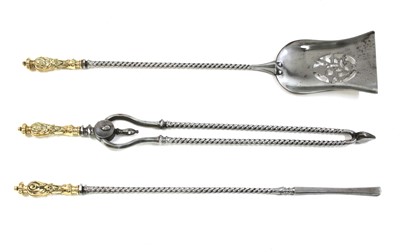 Lot 444 - A set of three twisted steel and brass fire tools