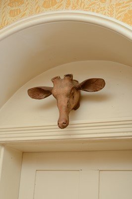 Lot 218 - A set of three carved wooden deer heads
