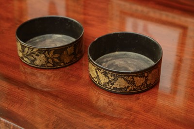 Lot 154 - A near pair of Regency papier-mâché bottle coasters