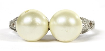 Lot 325 - A platinum pearl and diamond ring