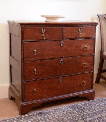 Lot 421 - An oak chest of two short over three long drawers