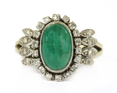 Lot 153 - A white gold emerald and diamond ring
