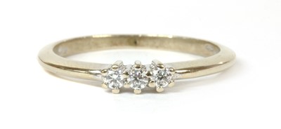 Lot 225 - A white gold three stone diamond ring