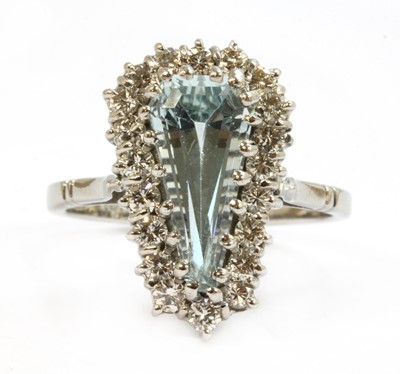 Lot 131 - A white gold aquamarine and diamond cluster ring