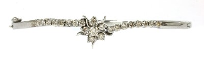 Lot 173 - A white gold diamond hinged bangle
