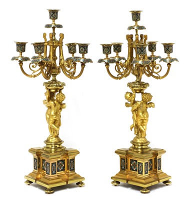 Lot 425 - A pair of gilt-bronze and champlevé enamel six-branch candelabra