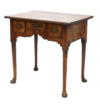 Lot 354 - A walnut and feather banded lowboy