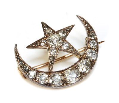 Lot 61 - A late Victorian diamond set crescent and star brooch