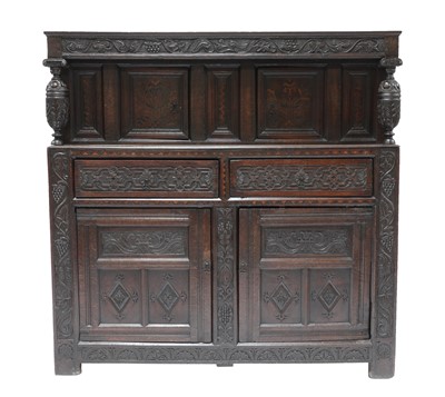 Lot 255 - A carved oak buffet cupboard