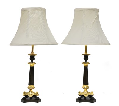 Lot 850 - A pair of French Empire-style bronze and gilt-bronze candlesticks