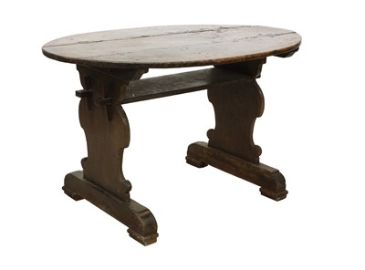 Lot 422 - A Continental walnut oval centre table