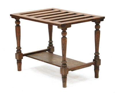 Lot 79 - A country oak luggage stand
