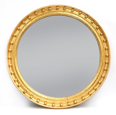 Lot 410A - A large Regency-style convex wall mirror