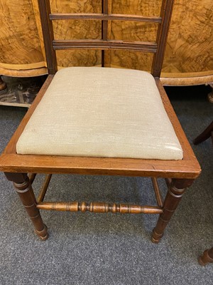 Lot 44 - A set of twelve Arts and Crafts walnut chairs