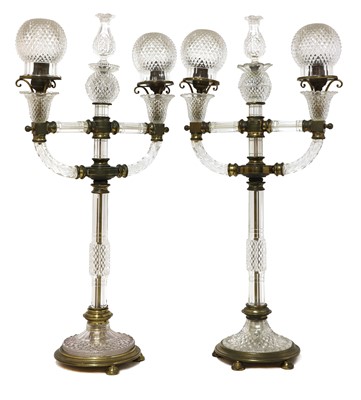 Lot 388 - A pair of cut glass and gilt brass electric lamps