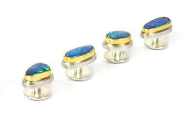 Lot 241 - A set of sterling silver and gold boulder opal dress studs by Josef Koppmann